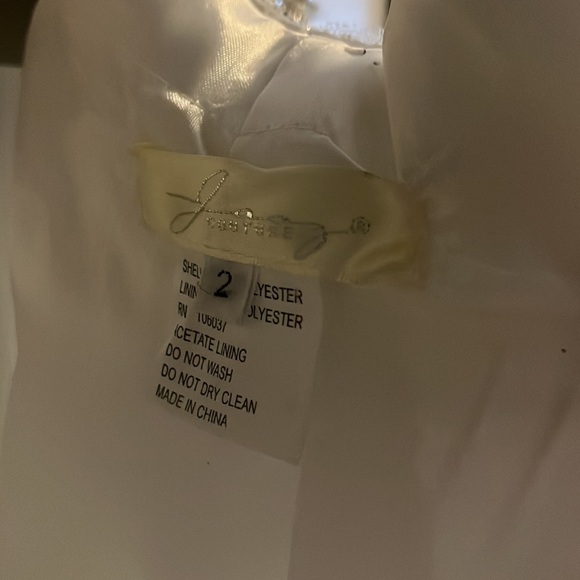 A Jasz Couture Beautiful white with blue florals formal dress with cut outs. - Picture 10 of 10